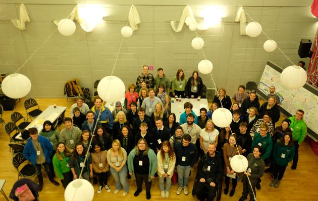 All the youth delegates standing together in a room