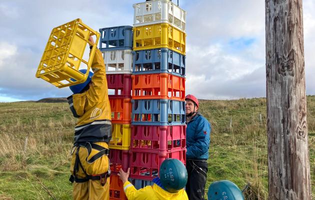 Boys building tower out of crates